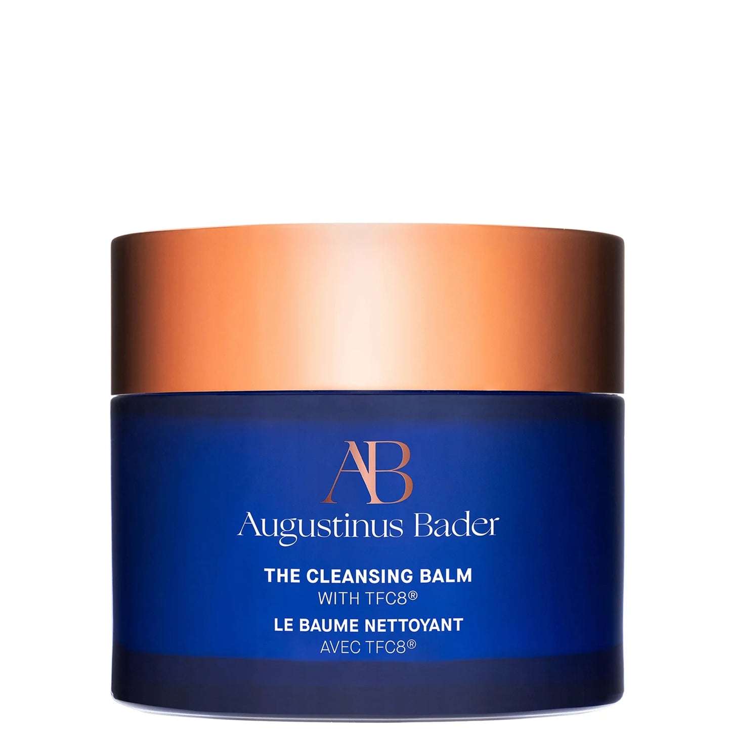 Augustinus Bader The Cleansing Balm, rich golden balm in a deep blue jar with copper lid, designed to gently remove makeup and impurities