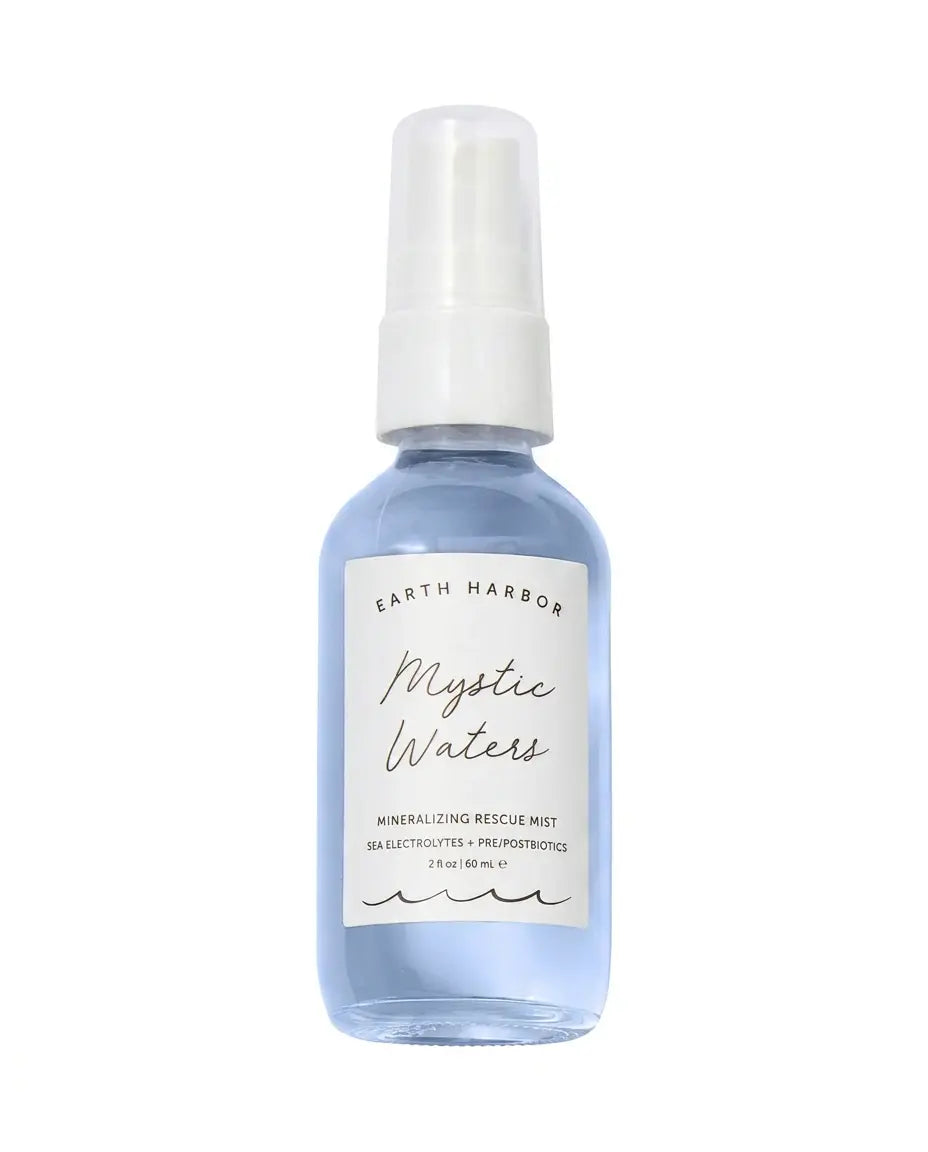 Earth Harbor Mystic Waters Mineralizing Rescue Mist, blue glass spray bottle with white label