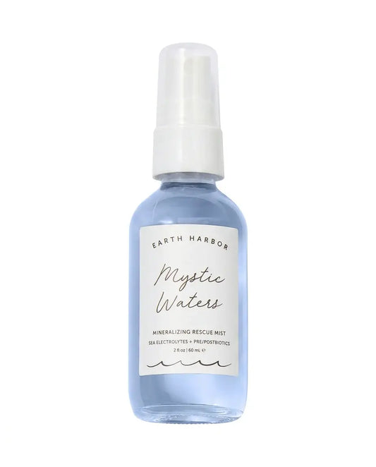 Earth Harbor Mystic Waters Mineralizing Rescue Mist, blue glass spray bottle with white label