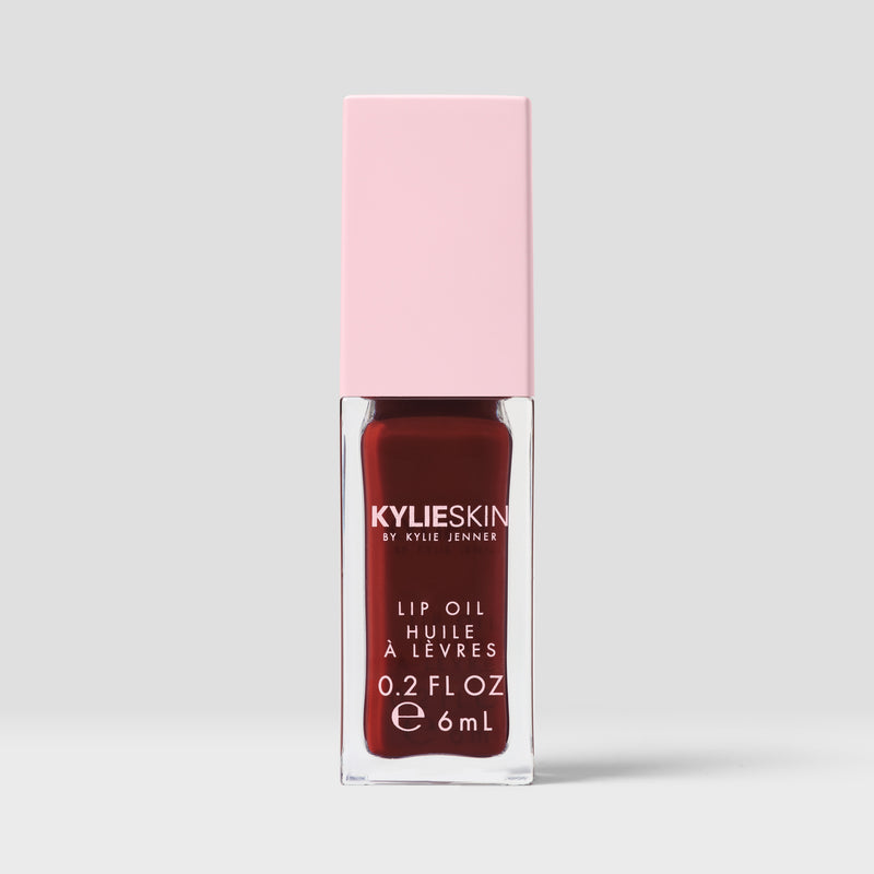 Kylie Skin Lip Oil Hazelnut Crème clear lip oil tube with soft nude-toned product inside