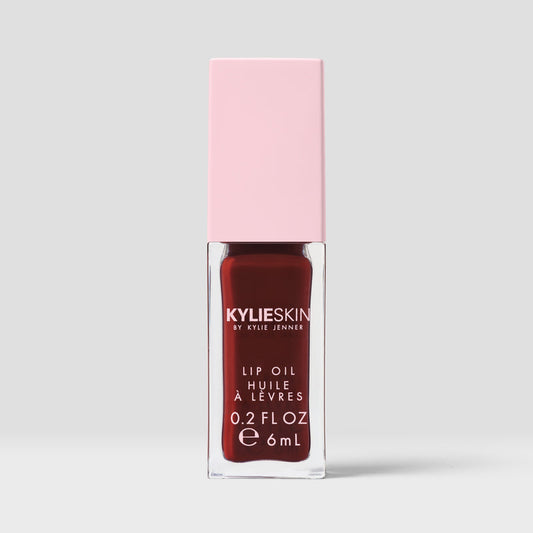 Kylie Skin Lip Oil Hazelnut Crème clear lip oil tube with soft nude-toned product inside