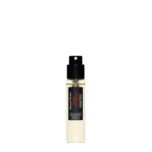 Frédéric Malle Une Rose Tonnerre 10ml, small cylindrical bottle with black cap and Frédéric Malle minimalist label