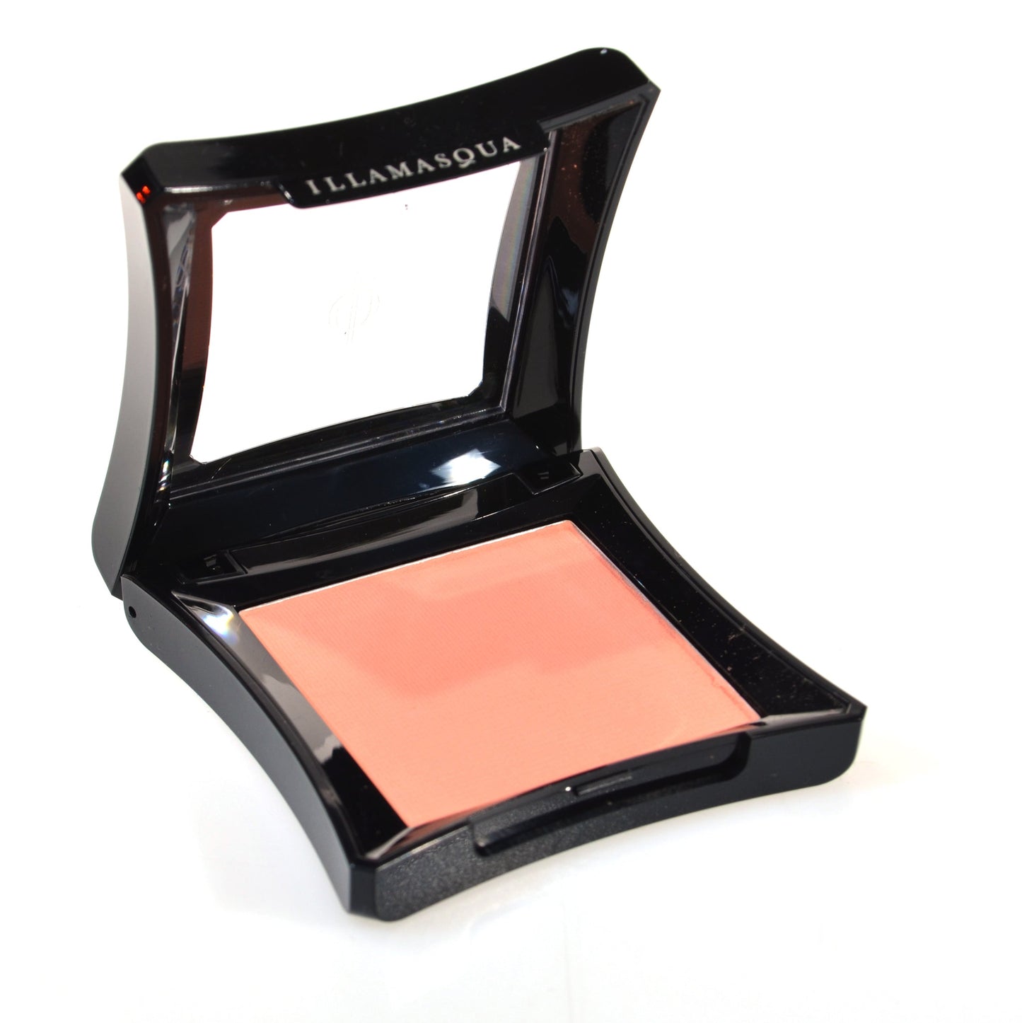 Illamasqua Powder Blusher in Lover, a warm peach matte shade in black compact.