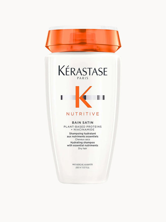Kérastase Nutritive Bain Satin Hydrating Shampoo for Dry Hair 250ml, pink and gold bottle with a screw cap and Kerastase branding