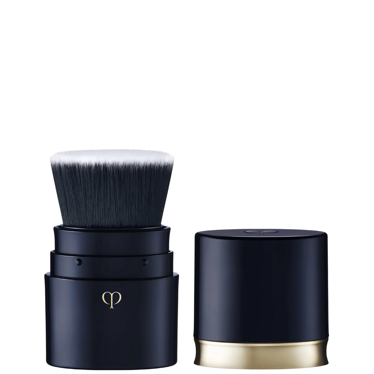 Clé de Peau Beauté Portable Brush, sleek retractable black and gold handle with domed bristle head