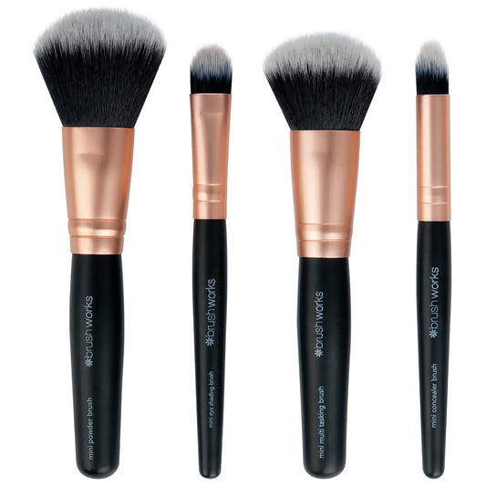 brushworks Mini Brush Set - Compact travel-size makeup brushes in black handles and soft bristles, arranged neatly on a vanity surface.
