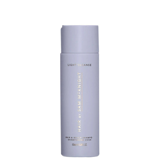 Hair by Sam McKnight Light Cleanse Hair and Scalp Shampoo 100ml, small white bottle with a flip cap and minimal black Hair by Sam McKnight lettering