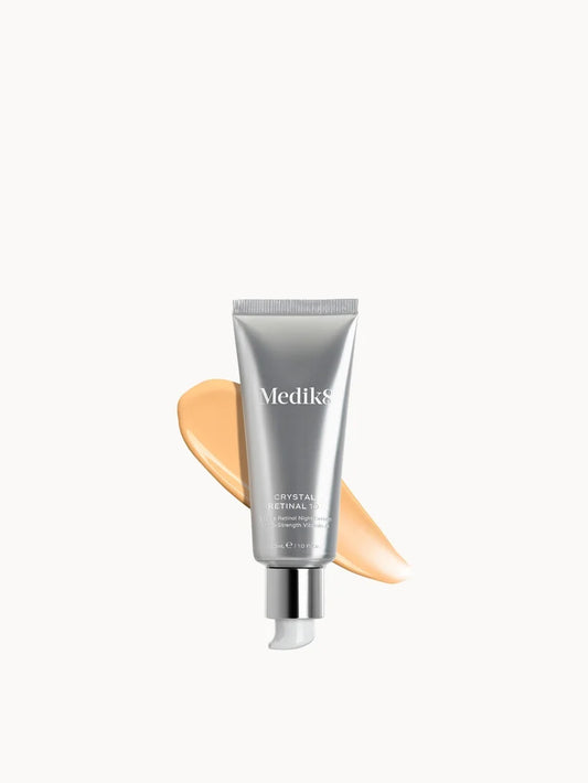 Medik8 Crystal Retinal 10 orange-tinted glass bottle with a black pump