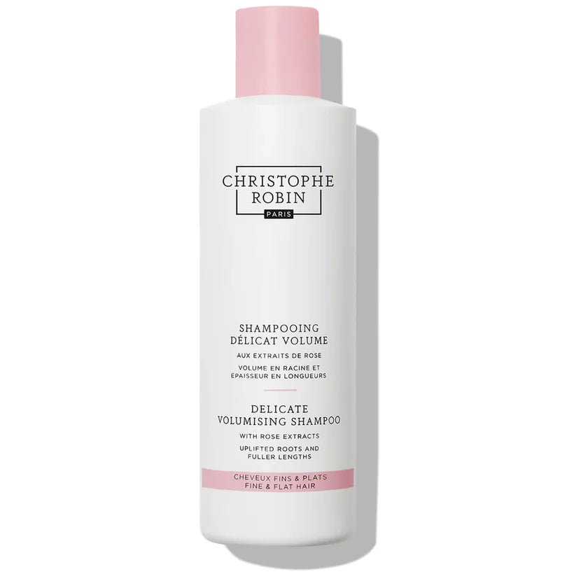 Christophe Robin Delicate Volumising Shampoo with Rose Extracts 250ml tall clear bottle with rose pink liquid and black cap packaging