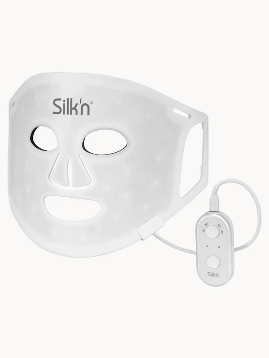 Silk'n Facial LED Mask 100 LEDs white full face mask device with eye openings and built-in LED lights shown front view