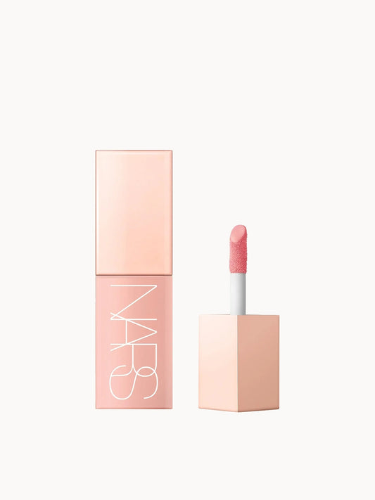 NARS Afterglow Liquid Blush in Orgasm, a peachy-pink shade with golden shimmer.