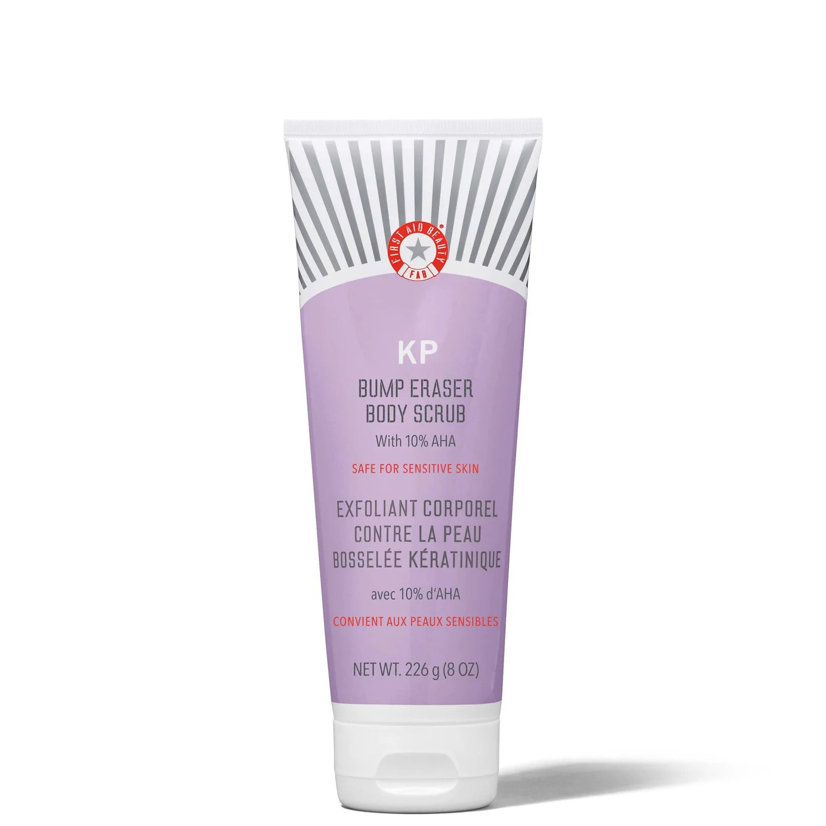 First Aid Beauty KP Bump Eraser Body Scrub 226g in lavender and white tube with bold text and flip cap