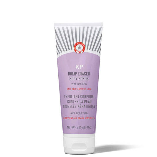 First Aid Beauty KP Bump Eraser Body Scrub 226g in lavender and white tube with bold text and flip cap
