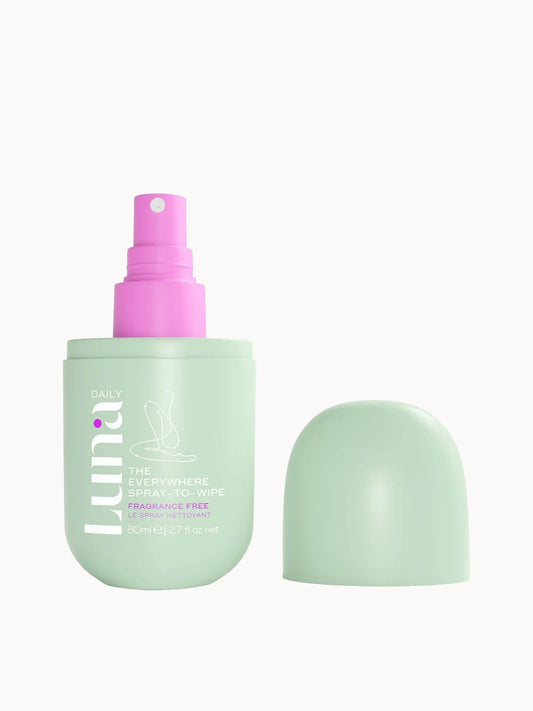 Luna Daily The Fragrance Free Spray - To - Wipe - pH - balancing Spray With Prebiotics + Vitamins C & E for Sensitive Skin 80ml, green spray bottle with purple cap and white label