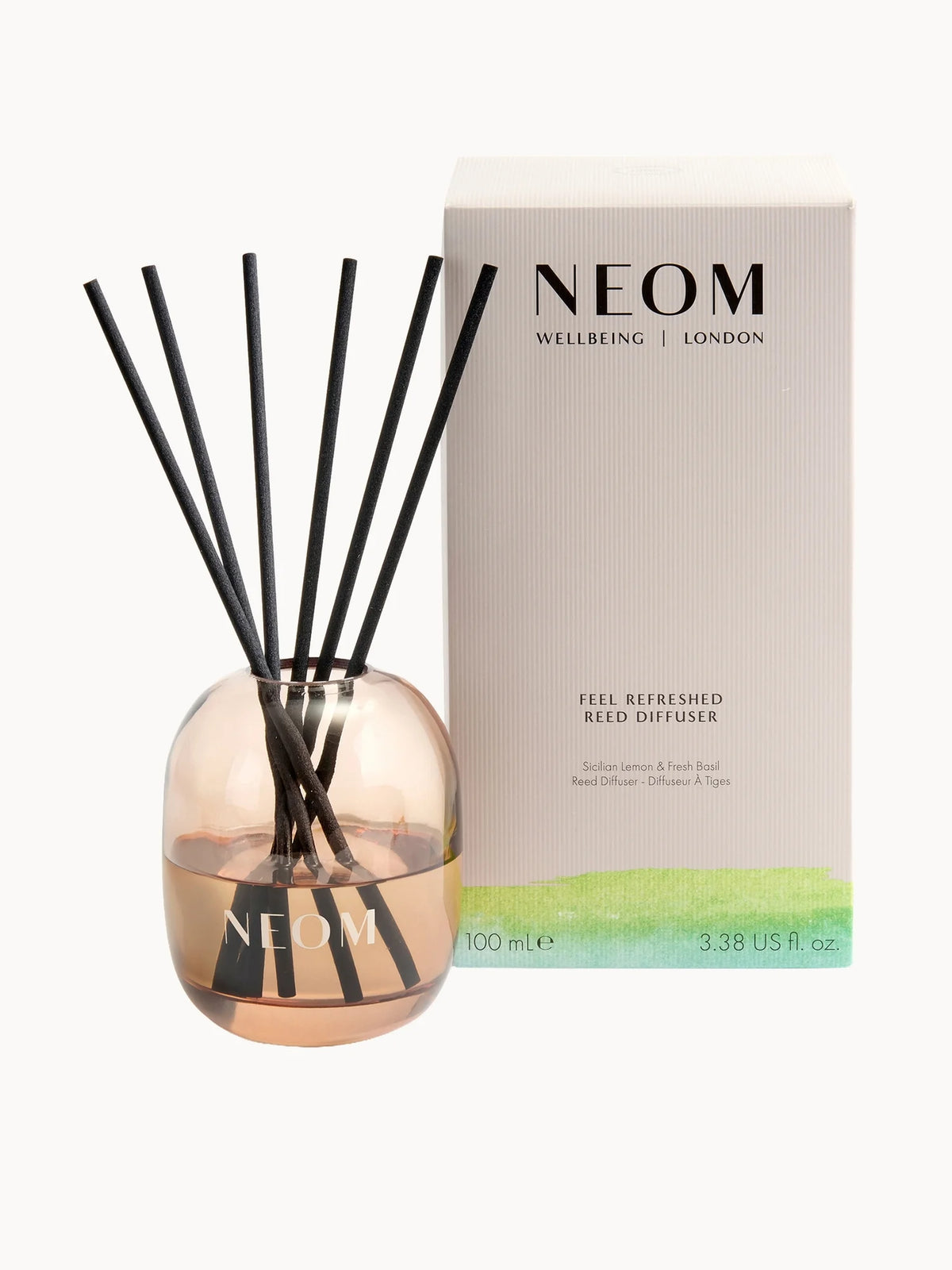 NEOM Wellbeing Feel Refreshed Reed Diffuser 100ml, clear glass bottle with reed sticks and NEOM Wellbeing Feel Refreshed label