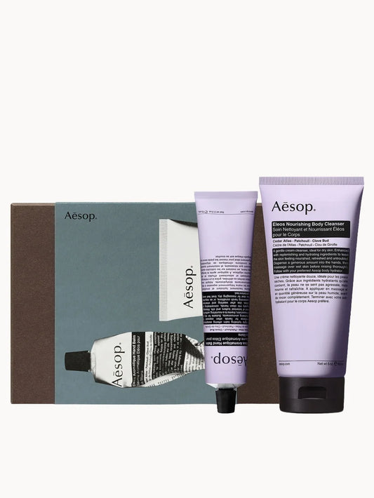 Aesop Shower Room Serenades gift set with body cleanser and shampoo bottles in signature amber packaging