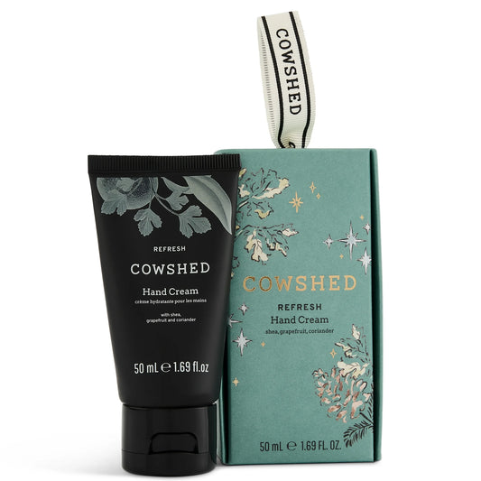 Cowshed Hand Cream Bauble 50ml, round bauble-shaped tube with gold cap and Cowshed cow-illustration branding