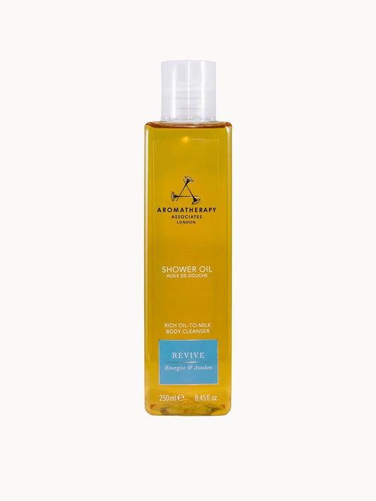 Aromatherapy Associates Revive Shower Oil 250ml clear bottle with gold cap and yellow oil inside