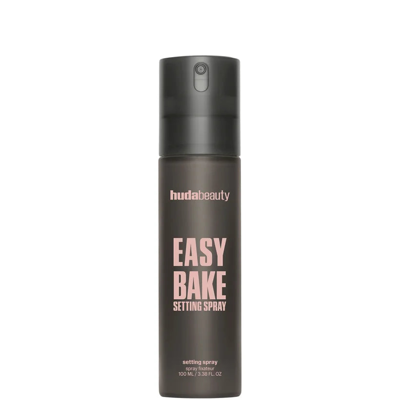 Huda Beauty Easy Bake Setting Spray 100ml frosted bottle with pink label and spray pump shown upright