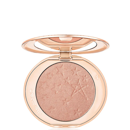 Charlotte Tilbury Hollywood Glow Glide Architect Highlighter Pillow Talk Glow pressed powder compact in rose gold case open to show shimmer pan