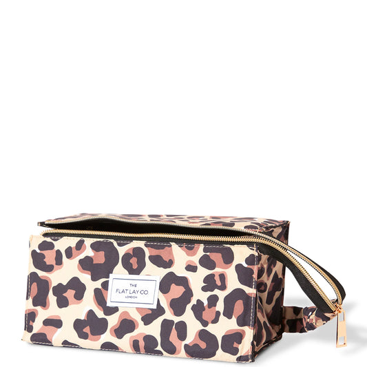 The Flat Lay Co. Open Flat Box Bag in leopard print with gold zip and spacious interior with open flat design for easy access to cosmetics and beauty tools