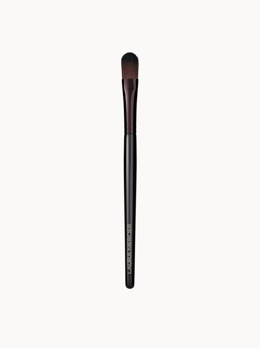 Laura Mercier Secret Brightening Powder Brush, flat oval brush head with synthetic bristles