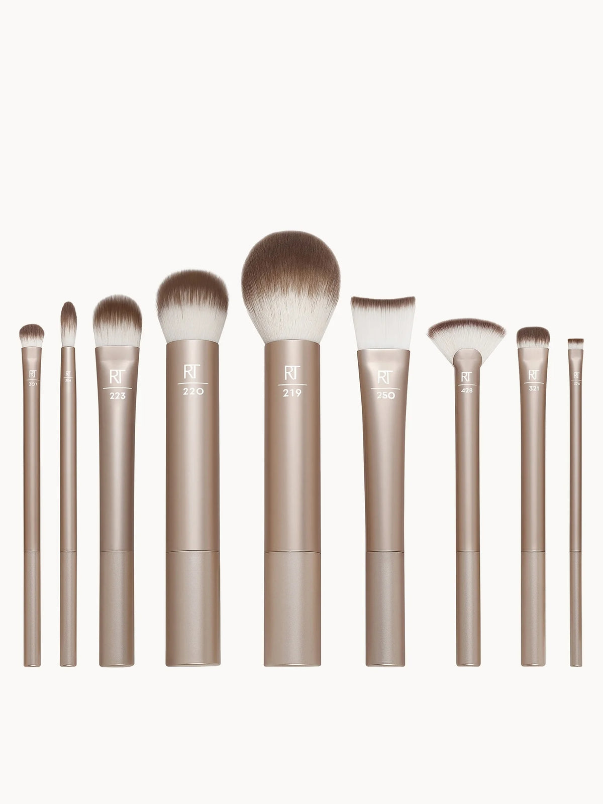 Real Techniques Au Naturale Complete Brush Kit, set of pink-handled brushes in a fold-out case with Real Techniques branding
