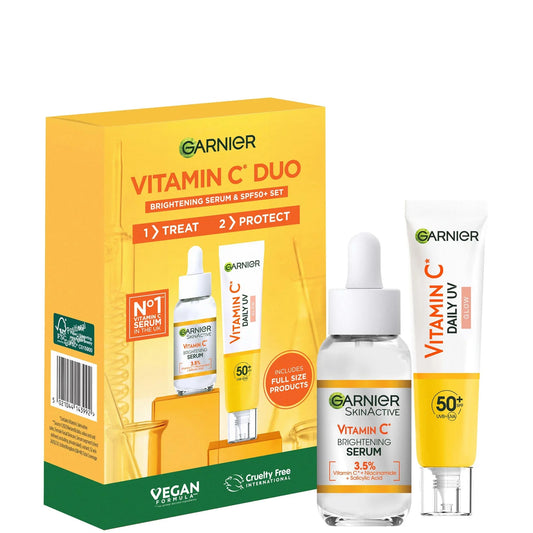 Garnier Vitamin C Brightening Serum & Glow UV Fluid SPF 50+ Duo Set, two small bottles side by side—one with serum and the other with white SPF fluid