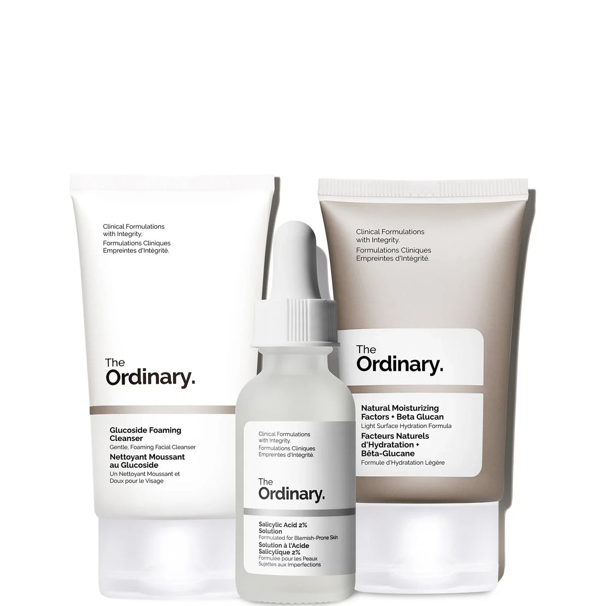 The Ordinary The Clear Set, three small black and white bottles with orange and red labels