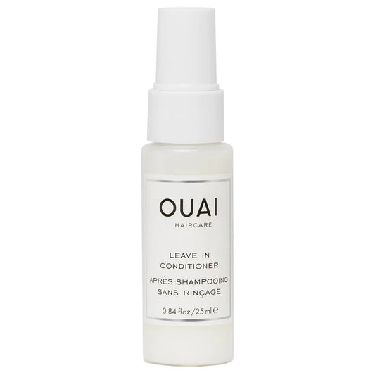 OUAI Leave-In Conditioner Deluxe travel size spray bottle with white body and pump dispenser