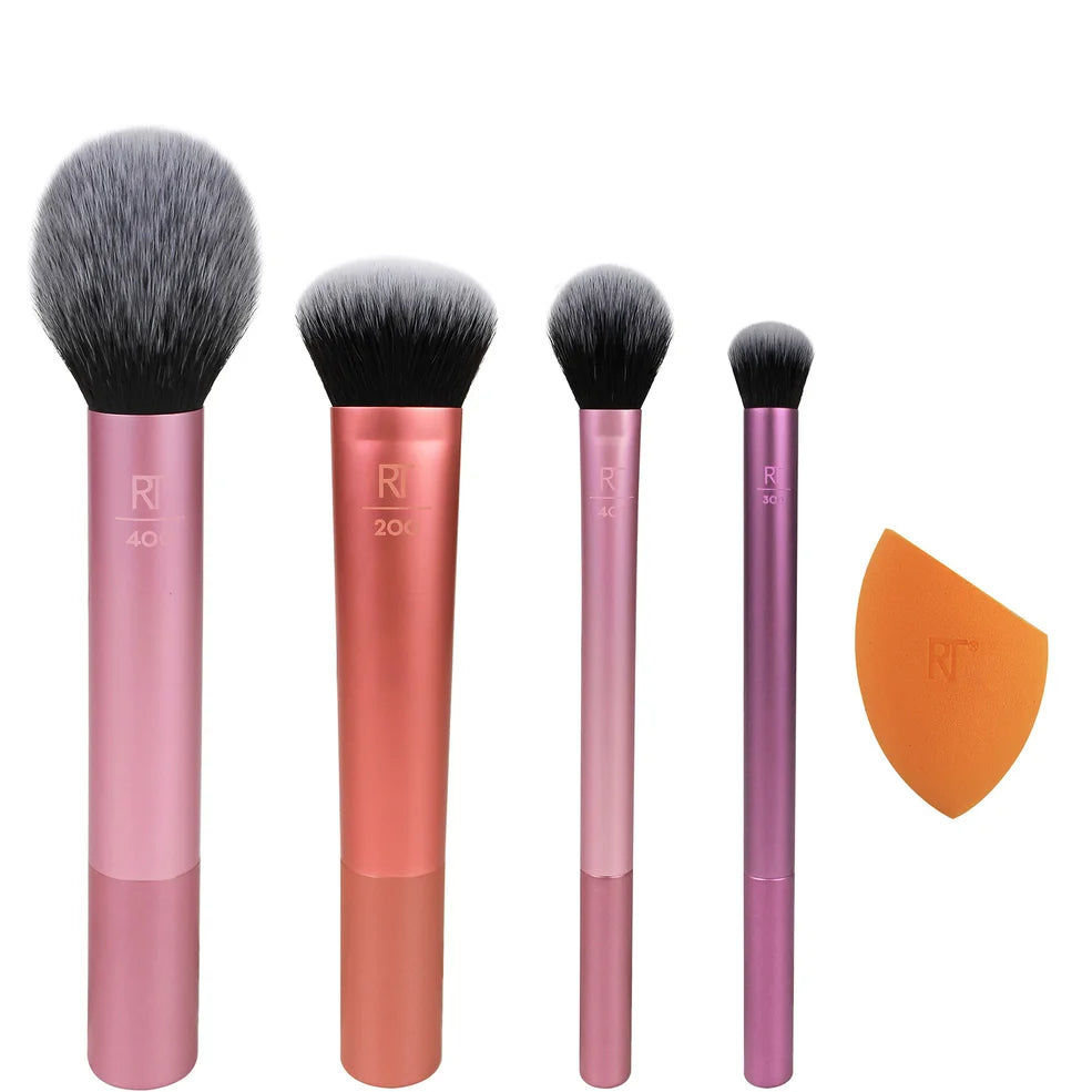 Real Techniques Everyday Essentials – a vibrant 4-piece makeup brush and sponge set with soft, colour-coded handles, designed for flawless foundation, blush, highlight, and blending application.