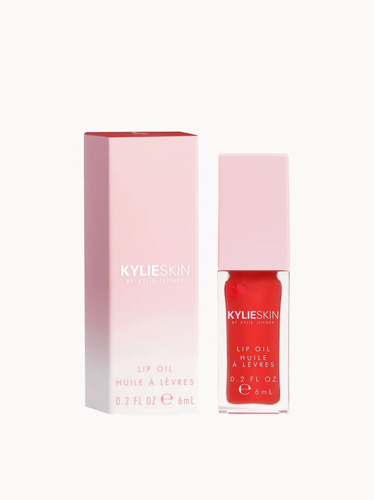 Kylie Skin Lip Oil Pomegranate 6ml, clear tube with red-tinted oil and doe-foot applicator