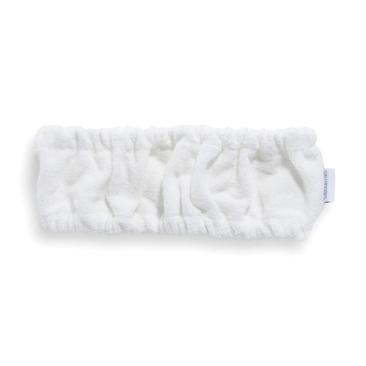 Revolution Sali Hughes Skincare Headband, soft white fabric headband with embroidered logo, designed to keep hair back during skincare or makeup routines