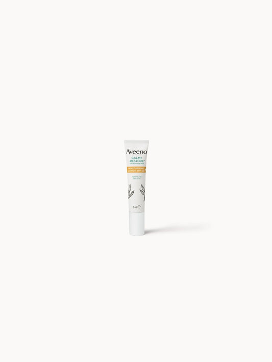 Aveeno Calm & Restore Moisturising Lotion SPF 50 15ml, small green travel-size tube with white Aveeno oat leaf branding