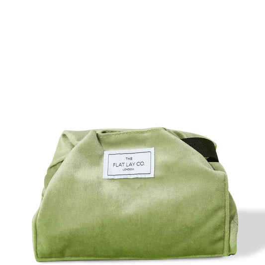 The Flat Lay Co. Velvet Drawstring Bag - sage green velvet pouch with gold drawstrings and flat-lay function